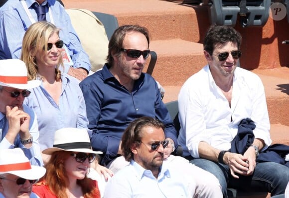 Michèle Laroque et Patrick Bruel pendant un match à Roland-Garros le 7 juin 2013.