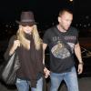 Heidi Klum et son compagnon Martin Kristen, à l'aéroport de Los Angeles, le 7 juin 2013.