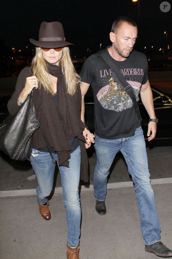 Heidi Klum et son compagnon Martin Kristen, à l'aéroport de Los Angeles, le 7 juin 2013.