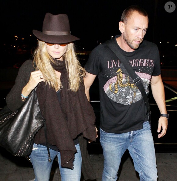 Heidi Klum et son compagnon Martin Kirsten à l'aéroport de Los Angeles, le 7 juin 2013.