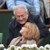 Dominique Strauss-Kahn et sa compagne Myriam L'Aouffir assistent à la victoire de Rafael Nadal lors des Internationaux de France à Roland-Garros le 9 juin 2013.