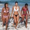 Nicole Murphy, ex-épouse de l'acteur Eddie Murphy, se détend sur une plage de Miami avec son amie Claudia Jordan et sa fille Zola (13 ans). Le 22 juin 2013.
