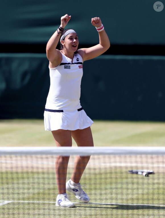 Marion Bartoli, aux anges lors de sa victoire en finale Wimbledon face à l'Allemande Sabine Lisicki. Londres, le 6 juillet 2013.