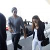 Eva Longoria et son compagnon Ernesto Arguello quittent l'hôtel George V et se rendent à l'aéroport Charles de Gaulle à Paris le 9 juillet 2013. Eva et Ernesto ont passé le week-end en amoureux dans la capitale avant qu'Eva Longoria pose lors d'un shooting pour l'Oréal dans un château.