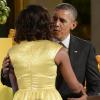 Barack Obama et sa femme Michelle Obama lors de la soirée Kids State Dinner, à la Maison-Blanche, organisée pour récompenser 50 jeunes américains dans le cadre du concours anti-obésité Healthy Lunchtime Challenge, le 9 juillet 2013.