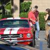 Amatrice de belles voitures, Sophia Bush s'est offert une Mustang GT 350 rouge flamboyante, qu'elle s'est empressée de conduire, le 24 juillet 2013.