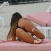 Claudia Romani se détend sur une plage de Miami. Le 4 aout 2013.