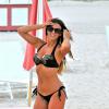 Claudia Romani se détend sur une plage de Miami. Le 4 août 2013.