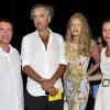 Le ministre de l'Intérieur, Manuel Valls, le philosophe Bernard-Henri Lévy et sa femme l'actrice Arielle Dombasle, et Anne Gravoin, l'épouse du ministre, posent pour une photo souvenir apres le concert du 'Travelling Quartet' d'Anne Gravoin, dans le cadre du Off du 64eme Festival de Musique de Menton, dans le sud de la France le 5 août 2013