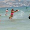 La belle Michelle Hunziker à Ibiza, le 26 juillet 2013, avec son compagnon Tomaso Trussardi et des proches