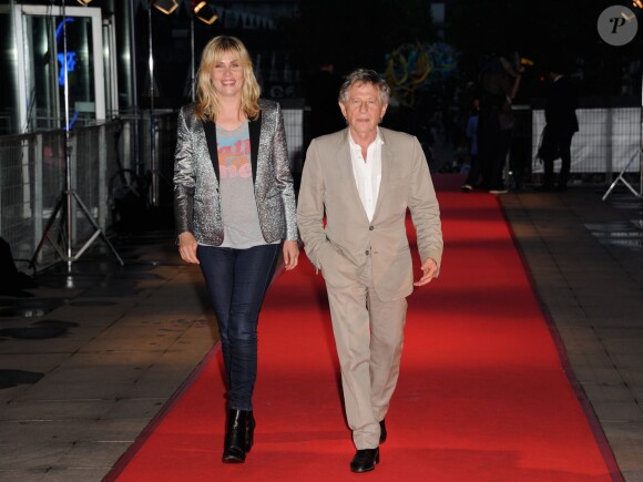 Emmanuelle Seigner et son mari Roman Polanski arrivent à la première du film "Blue Jasmine" à l'UGC Bercy, Paris, le 27 août 2013.