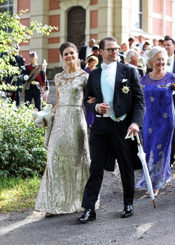 La princesse Victoria de Suède et le prince Daniel de Suède - Mariage de Gustaf Magnuson (fils de la soeur du roi Carl XVI Gustaf de Suède) et Vicky Andren au château d'Ulriksdals à Stockholm, le 31 août 2013.