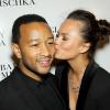 John Legend et sa fiancée Chrissy Teigen lors du défilé Badgley Mischka printemps-été 2014 à New York, le 10 septembre 2013.
