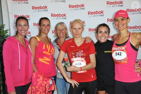 Linda Hardy, Laure Manaudou, Anna Sherbinina, Alissa Mckaig (gagnante de la Parisienne 2013) et Sandrine Retailleau (directrice generale de Reebok) lors de la course La Parisienne qui se déroulait à Paris le 15 septembre 2013