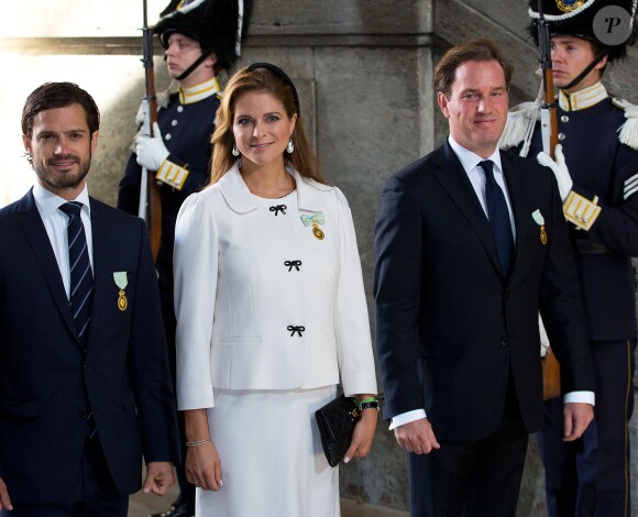 Le prince Carl Philip, la princesse Madeleine de Suède, enceinte, et son époux Chris O'Neill au palais royal à Stockholm le 15 septembre 2013 pour le Te Deum du jubilé des 40 ans de règne du roi Carl XVI Gustaf de Suède.