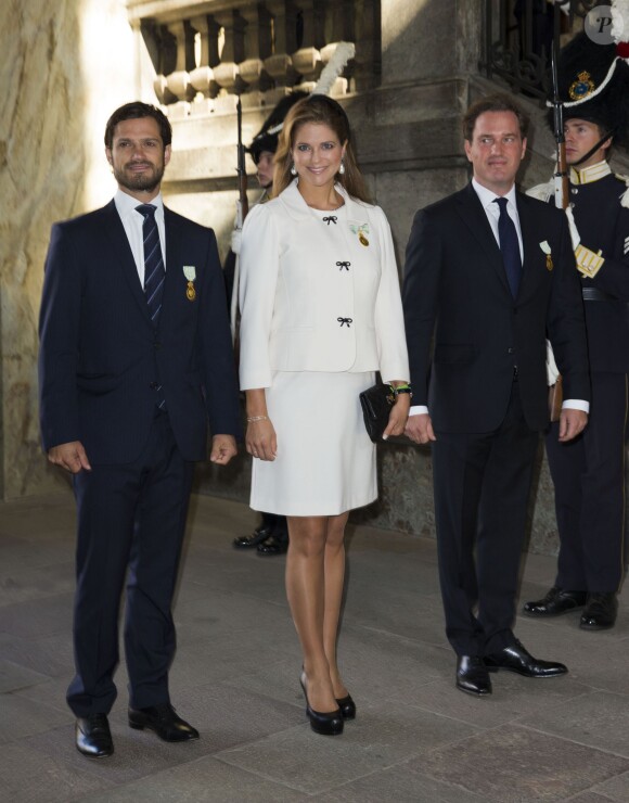 Le prince Carl Philip, la princesse Madeleine, enceinte, et Christopher O'Neill au palais à Stockholm le 15 septembre 2013 pour le Te Deum du jubilé des 40 ans de règne du roi Carl XVI Gustaf de Suède dans la chapelle royale.