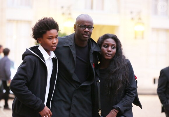 Lilian Thuram, décoré de la Légion d'honneur, et son fils Khephren à l'Elysée, le 17 septembre 2013.