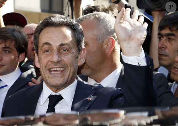 Nicolas Sarkozy quitte le siège parisien de l'UMP le 8 juillet 2013 à Paris