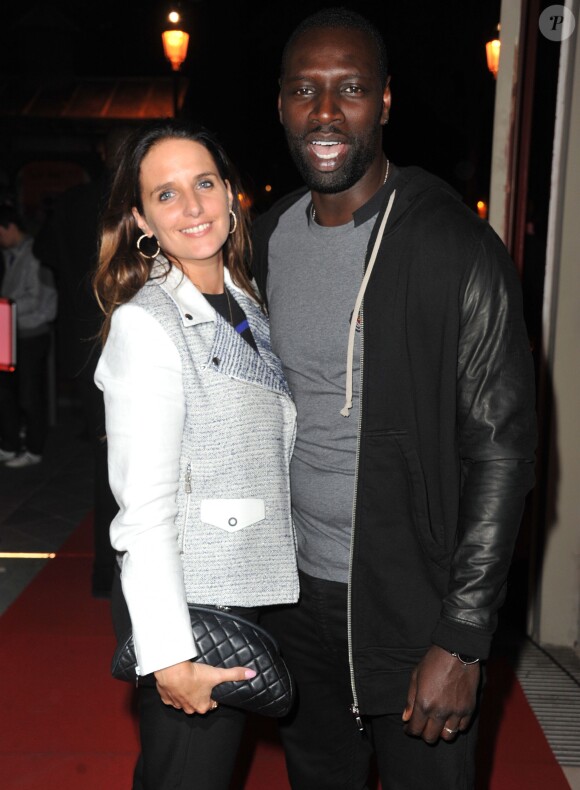 Omar Sy et sa femme Hélène lors de la soirée de lancement de FIFA 14 à la Gaîté lyrique à Paris le 23 septembre 2013. Auparavant, la vente de packs collector avait permis de lever 12 000 euros pour leur association Cé Ke Du Bonheur.