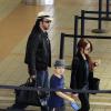 Nicolas Cage à l'aéroport de Los Angeles le 23 septembre 2013 avec sa femme Alice Kim et son fils Kal-El