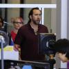 Nicolas Cage à l'aéroport de Los Angeles le 23 septembre 2013 : on découvre sa nouvelle et improbable coupe de cheveux faite d'extensions
