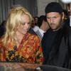 Pamela Anderson et son ex-époux Rick Salomon lors du défilé Vivienne Westwood printemps-été 2014 au Centorial. Paris, le 28 septembre 2013.