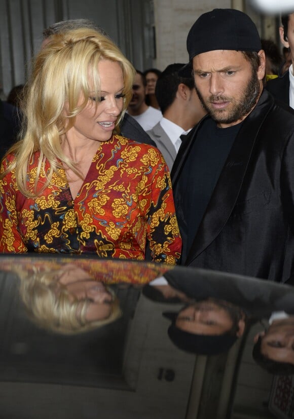 Pamela Anderson et son ex-époux Rick Salomon lors du défilé Vivienne Westwood printemps-été 2014 au Centorial. Paris, le 28 septembre 2013.