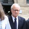 L'ex-kiné des stars Pierre Pallardy et sa femme Florence Pallardy, en compagnie de leur avocat Hervé Temime, arrivent aux assises de Paris où debute son procès pour viols et agressions sexuelles sur plusieurs anciennes patientes le 3 octobre 2013.