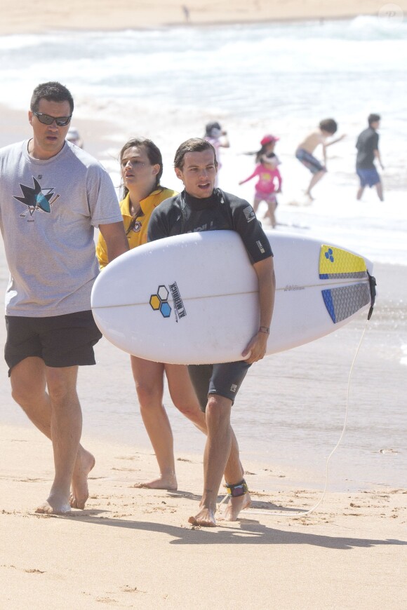 Liam Payne et Louis Tomlinson du groupe One Direction apprennent à faire du surf sur une plage de Sydney, le 7 octobre 2013.