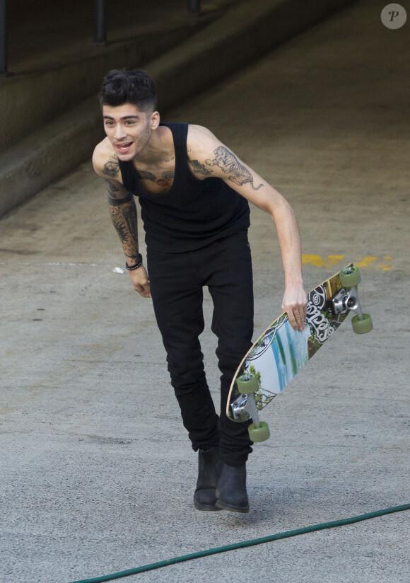 Zayn Malik s'amuse avant le concert des One Direction à Sydney, le 26 octobre 2013.