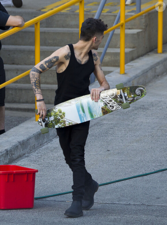 Zayn Malik s'amuse avant le concert des One Direction à Sydney, le 26 octobre 2013.