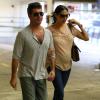 Simon Cowell et sa compagne Lauren Silverman (enceinte) à Beverly Hills, le 12 octobre 2013.