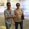 Simon Cowell et sa compagne Lauren Silverman (enceinte) dans les rues de Beverly Hills, le 12 octobre 2013.