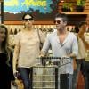 Simon Cowell et sa compagne Lauren Silverman (enceinte) au magasin Whole Foods à Beverly Hills, le 12 octobre 2013.