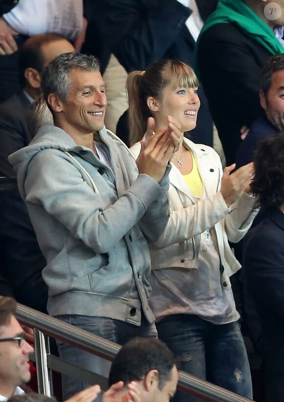 Nagui et sa femme Mélanie Page au Parc des Princes le 22 septembre 2013.