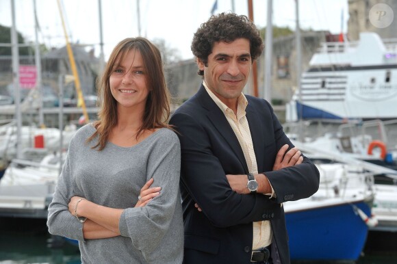 Abdelhafid Metalsi et Carole Bianic posent pour le photocall de la serie 'Chérif ' durant le 15e Festival de la Fiction TV de La Rochelle le 13 septembre 2013.