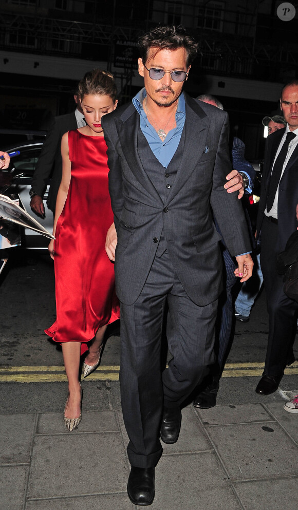 Johnny Depp et Amber Heard à Londres, le 22 juillet 2013.