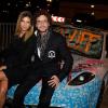 L'artiste Karl Lagasse et Isabelle Funaro, à l'Automobile Club de France, à Paris, à l'occasion de la soirée de vente aux enchères au profit de l'association AMFE, le mercredi 13 novembre 2013.