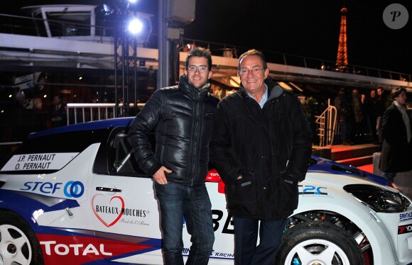 Jean-Pierre Pernaut et son fils aîné Olivier posent devant leur Citroen DS3 lors de la conférence de presse de la 25e édition du Trophée Andros à Paris le 27 novembre 2013.