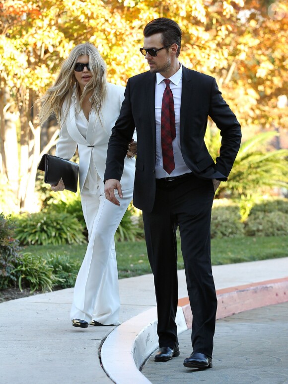 La chanteuse Fergie et son mari Josh Duhamel baptisent leur fils Axl Jack dans une église à Brentwood, le 12 décembre 2013.