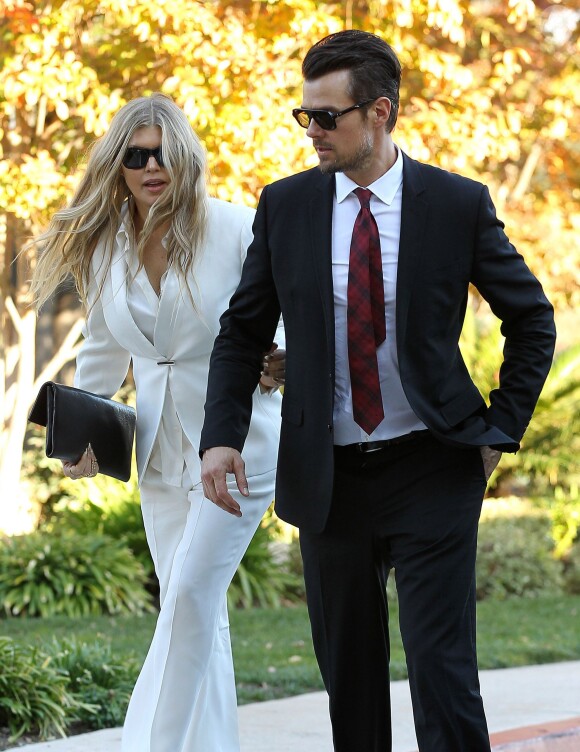 La chanteuse Fergie et son mari Josh Duhamel baptisent leur fils Axl Jack dans une église à Brentwood, le 12 décembre 2013.