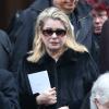 Catherine Deneuve quittant les obsèques de Kate Barry en l'église Saint-Roch à Paris le 19 décembre 2013