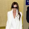 Victoria Beckham, tout de blanc vêtue, arrive à l'aéroport JFK. New York, le 11 janvier 2014.