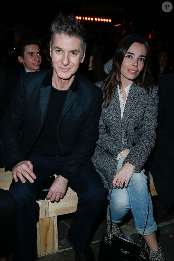 Etienne Daho et Elodie Bouchez - People au defile Homme Saint Laurent Automne/Hiver 2014-2015 a Paris, le 19 janvier 2014.