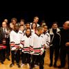 Le président François Hollande à Trappes (Yvelines) pour un match d'improvisation théâtrale entre deux collèges de la ville lors de la 4e édition du trophée d'Improvisation de la fondation Culture & Diversité, aux côtés du parrain Jamel Debbouze et du président de la fondation, Marc Ladreit de Lacharrière, le 7 février 2014.
