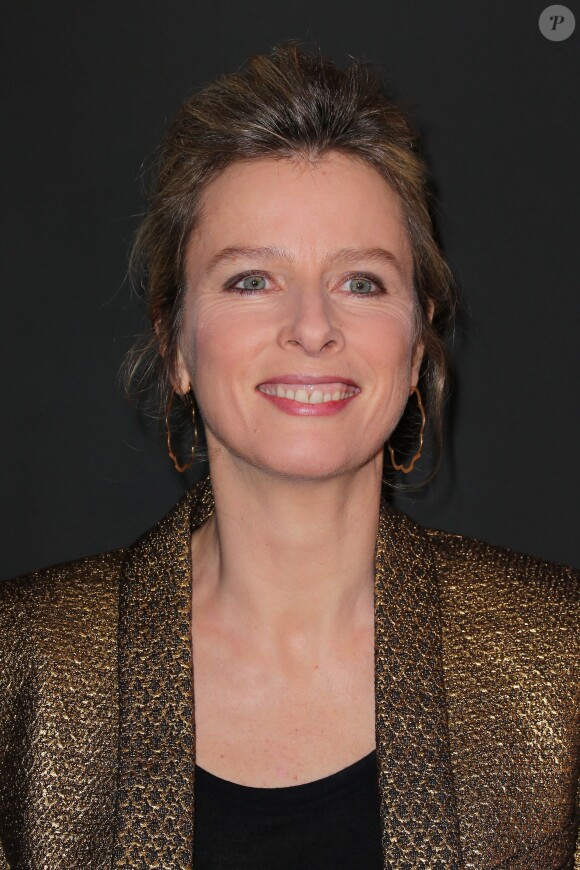Karin Viard lors du défilé Etam à la Bourse du Commerce Paris, le 25 février 2014.