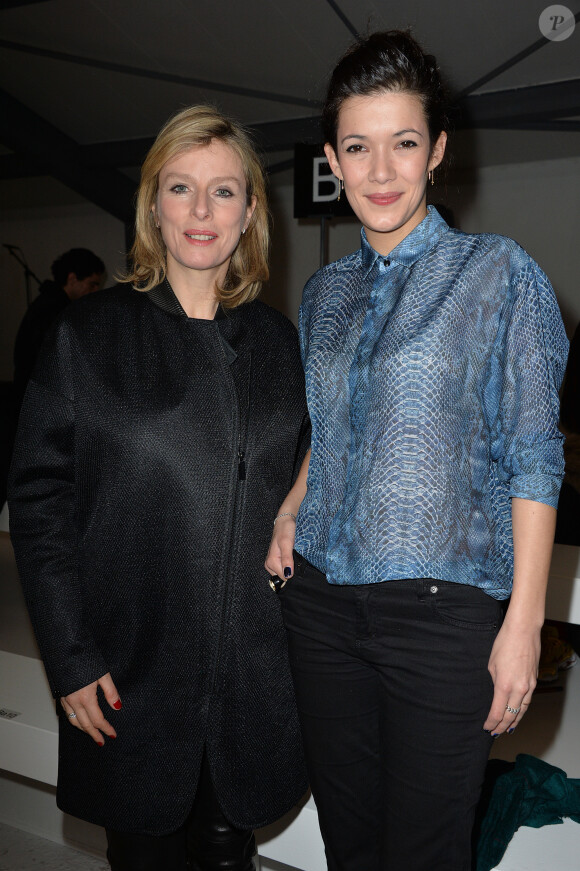Karin Viard et Mélanie Doutey assistent au défilé Barbara Bui automne-hiver 2014-15 au Garage Turenne. Paris, le 27 février 2014.