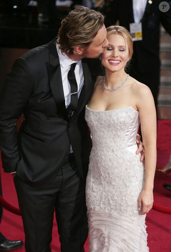 Kristen Bell et son époux Dax Shepard à la 86e cérémonie des Oscars, à Los Angeles le 2 mars 2014.