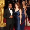 Chiwetel Ejiofor et sa petite amie Sari Mercer à la 86e cérémonie des Oscars, à Los Angeles le 2 mars 2014.
