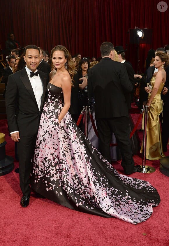 John Legend et Chrissy Teigen à la 86e cérémonie des Oscars, à Los Angeles le 2 mars 2014.